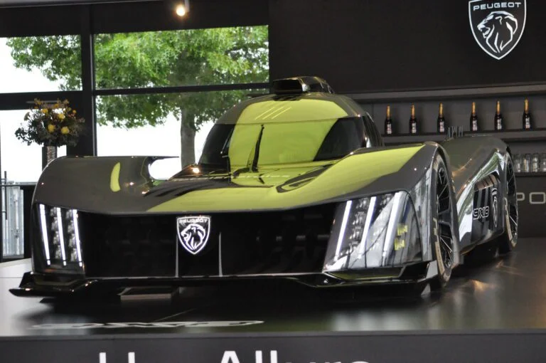 The Peugeot 9X8 Le Mans Hypercar on display