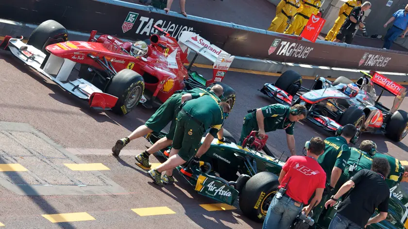 mechanics preparing cars for the formula 1 grid in monaco