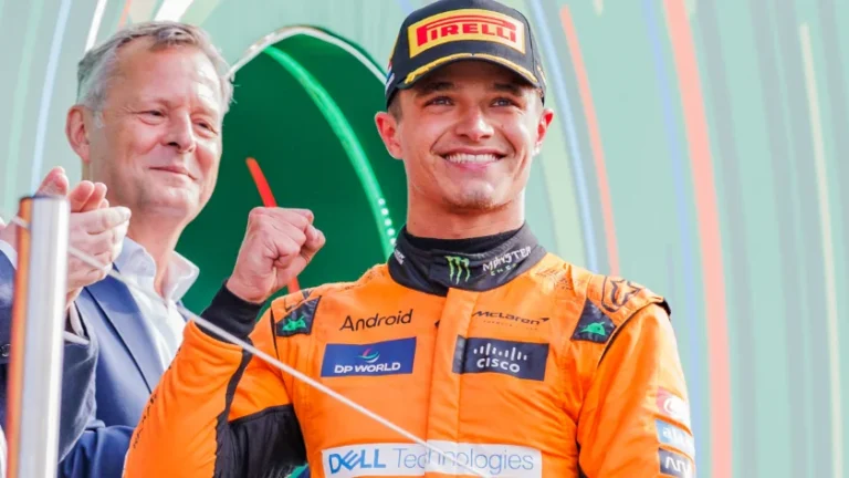 Lando Norris posing on a podium