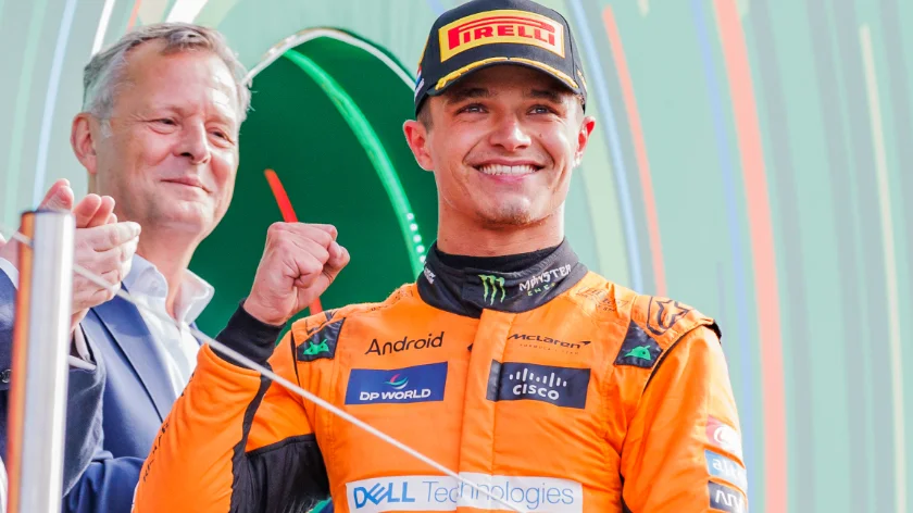 Lando Norris posing on a podium